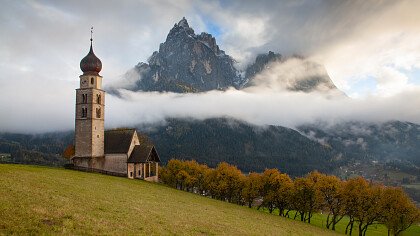 street to the church st valentino in autumn siusi - Shutterstock