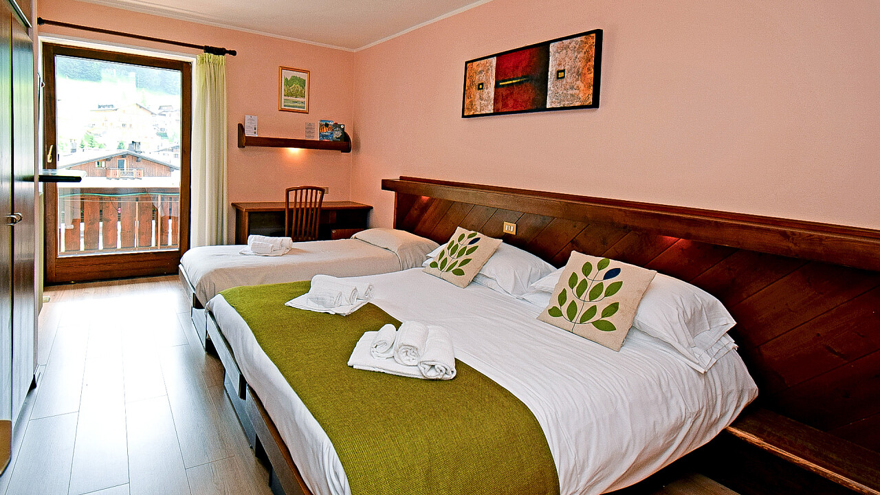 Letto matrimoniale e letto singolo - Camera tripla - Hotel Comelico