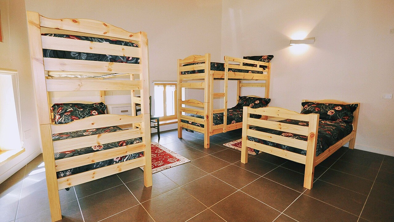 Camera con cinque posti letto