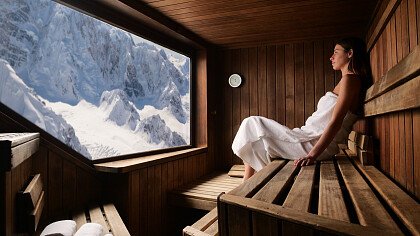 Couple relaxing in a luxury hotel with mountain view