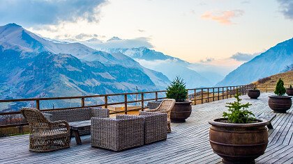 Couple relaxing in a luxury hotel with mountain view