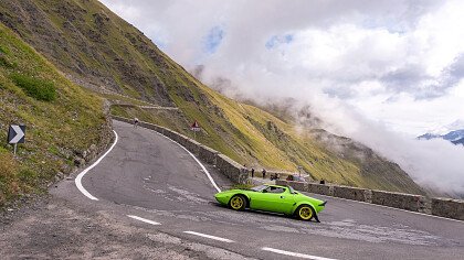 Cars in autumn along the roads of the Dolomites